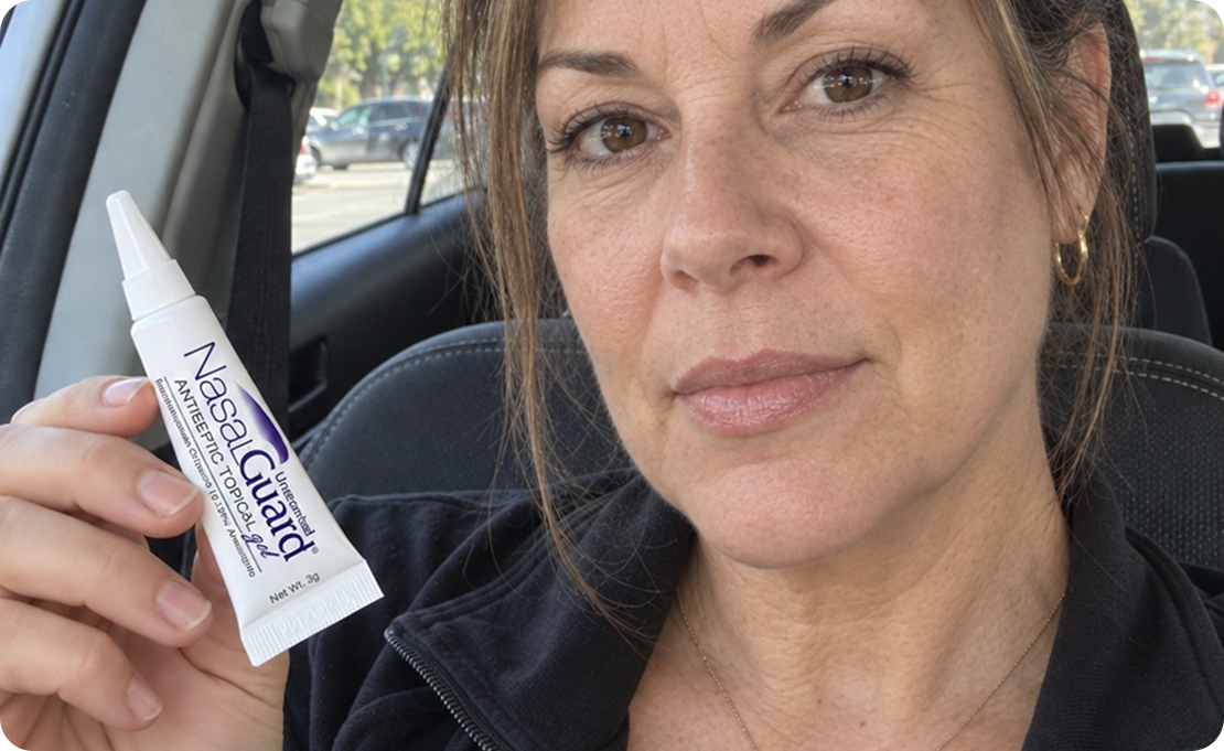 Woman applying NasalGuard in the car